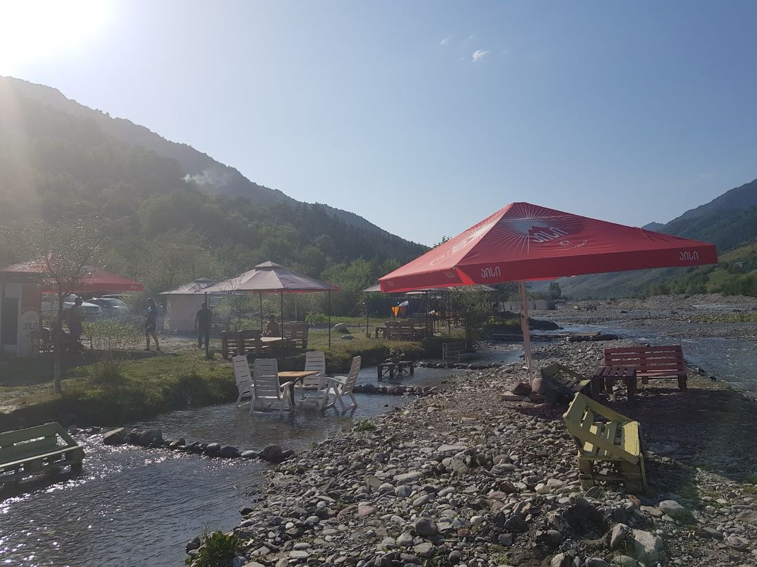 Georgian mtsvadi barbecue and khinkali by the river after rafting